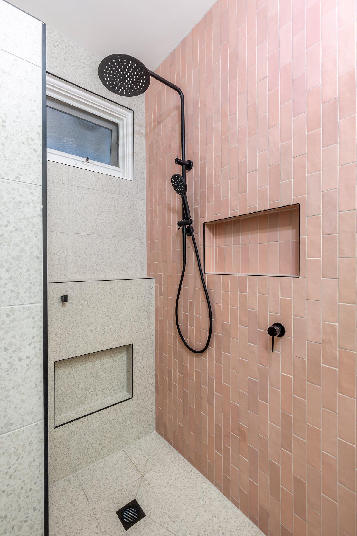 Shower Head and Pink Bricked Wall - Bathroom Renovation in Melbourne